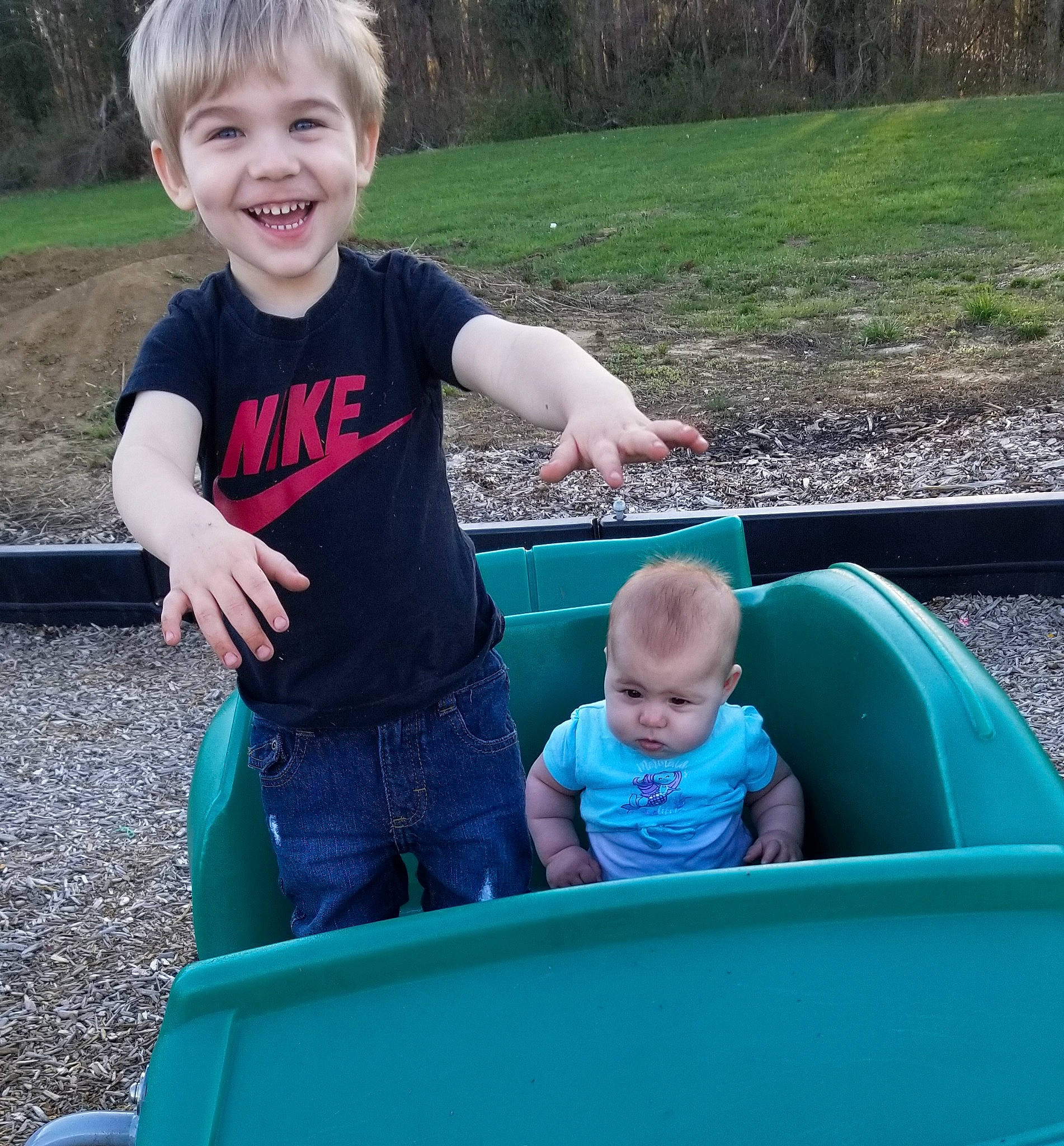 Gunnar is registered to the contest to win money with this photo: baby, child, fun, garden, grass, green, joy, lawn, leisure, outdoor_play_equipment, person, play, product, recreation, sitting, summer, toddler, vacation, vehicle