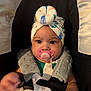 baby, pacifier, car_seat, blanket, headwear, infant, child, straps, closeup, cute, expression, indoors, soft_toys, comfort, seatbelt, clothing, person, adorable, head, face