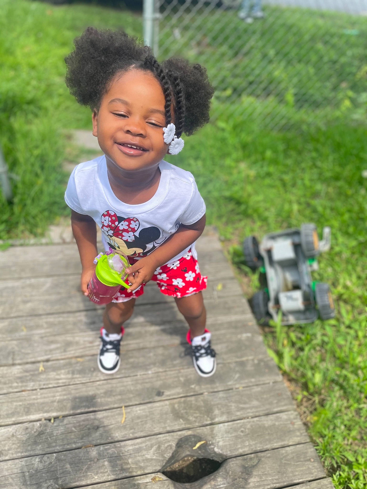 Harmonii is registered to the contest to win money with this photo: baby, baby_toddler_clothing, child, flooring, fun, grass, happy, joy, leisure, people_in_nature, person, plant, play, recreation, sandal, sitting, smile, soil, tire, toddler