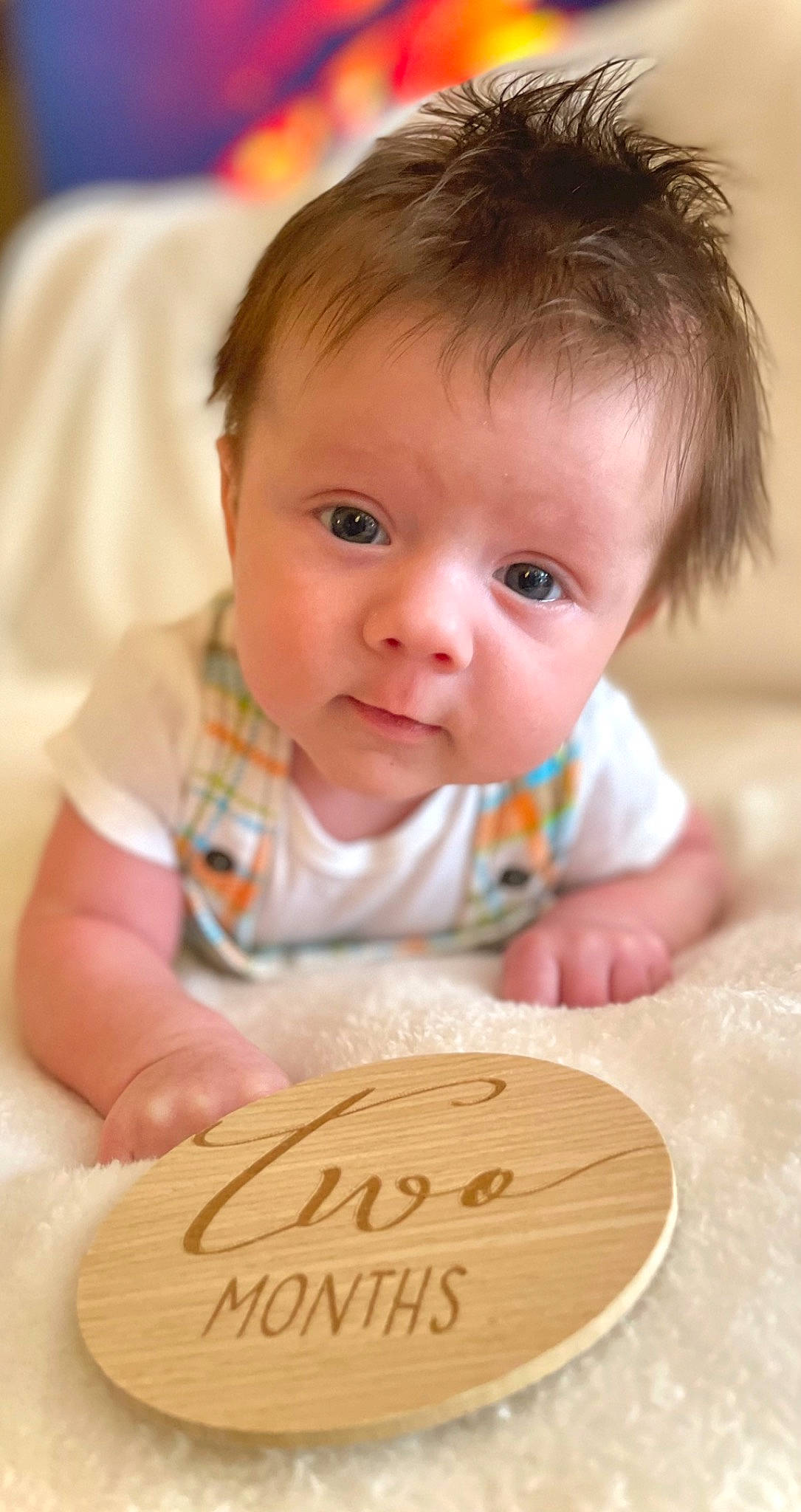 Fisher is registered to the contest to win money with this photo: arm, baby, baby_playing_with_toys, baby_toddler_clothing, cheek, child, chin, dress, finger, fun, hair, happy, hardwood, nose, person, product, sitting, skin, sweetness, toddler