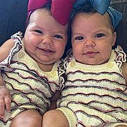 La Naya And Anola joined the competition — help win amazing prizes! baby, twins, bow, headband, smile, cute, knitwear, infant, child, toddler, face, portrait, sitting, happy, couch, cuddling, closeup, indoors, person, fashion
