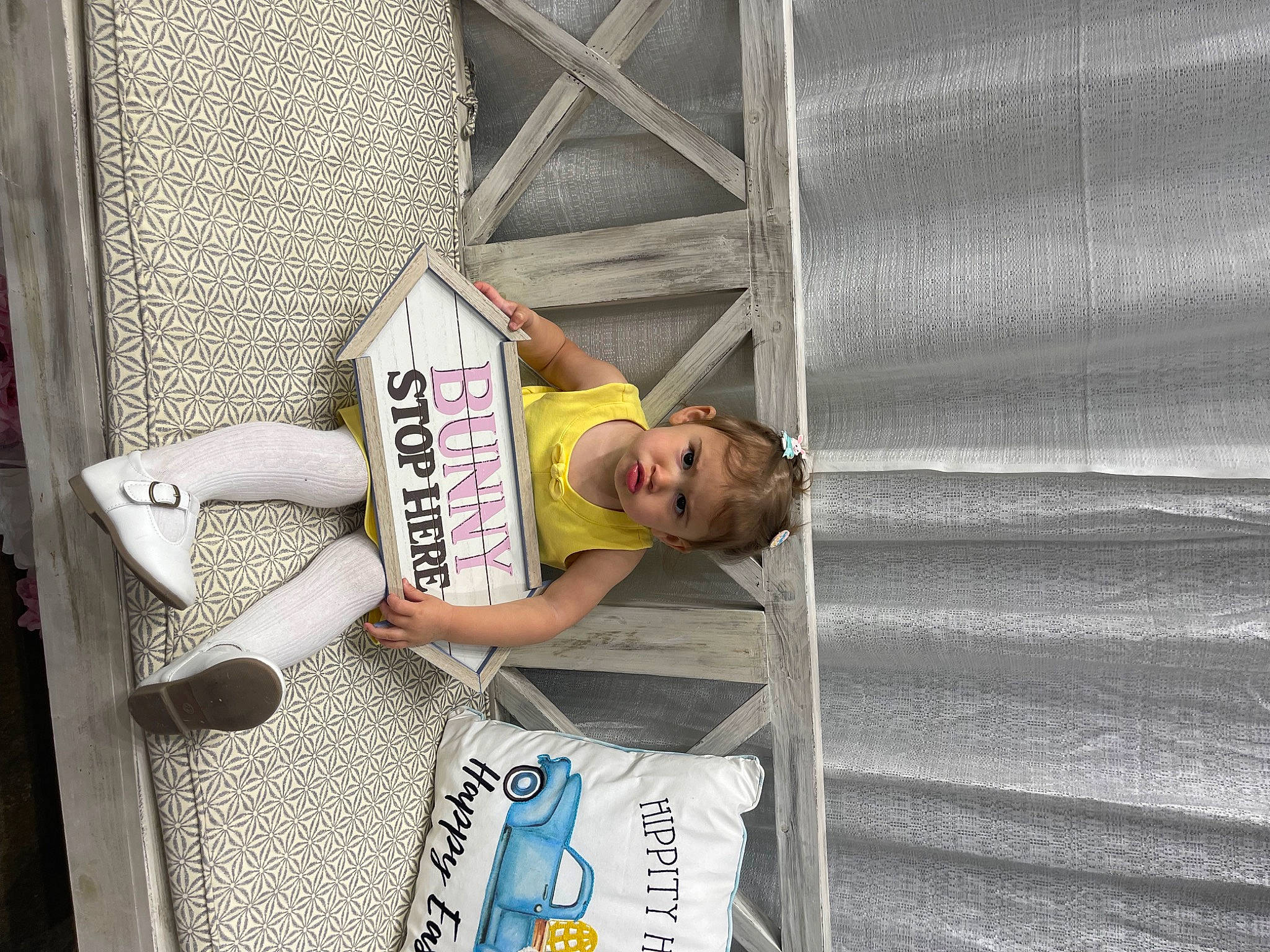 Everleigh joined the competition — help win amazing prizes! advertising, elbow, eyewear, font, hat, human_leg, pattern, person, sitting, street, t_shirt, thigh, wood