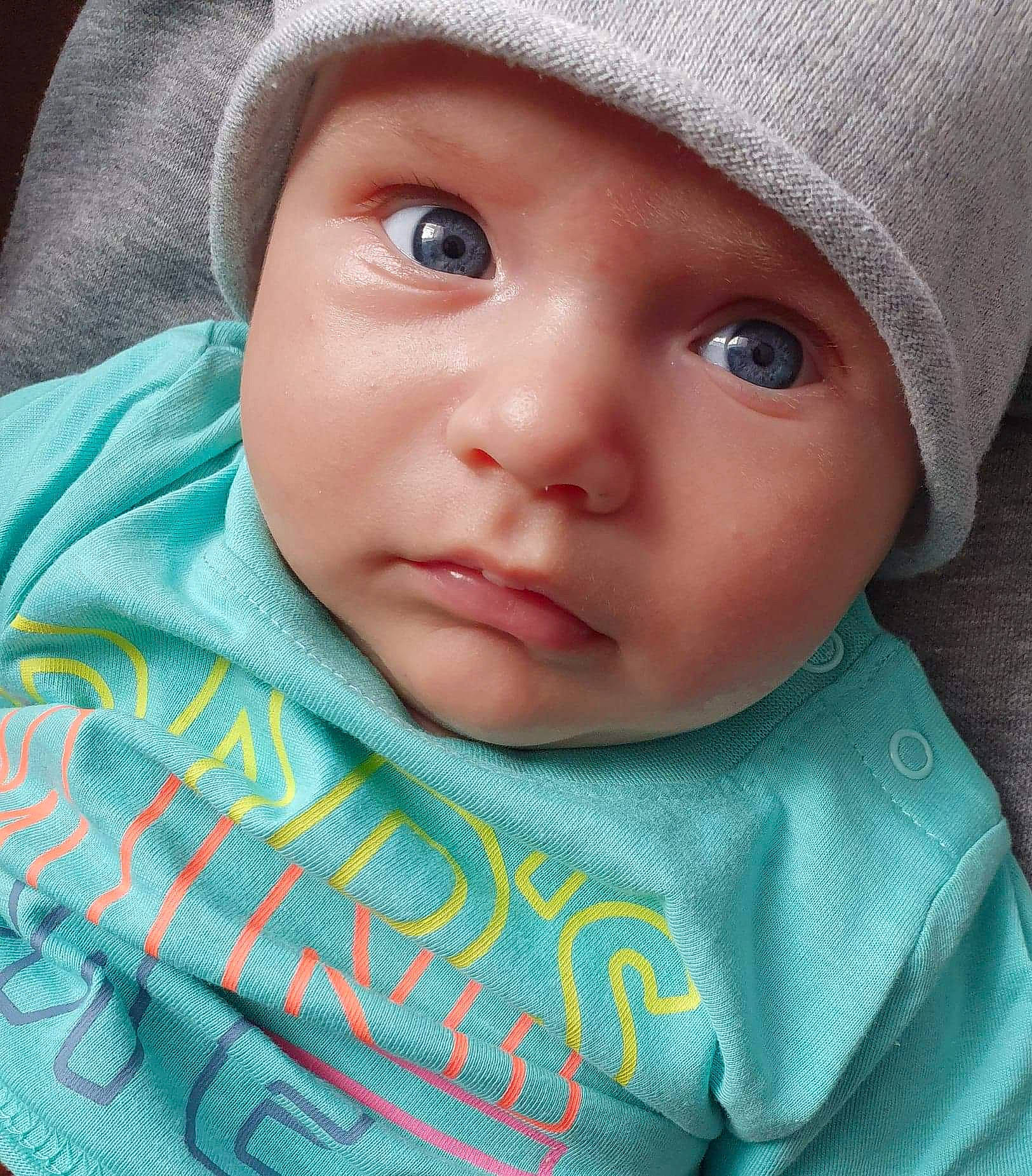 Denis is registered to the contest to win money with this photo: baby, cheek, child, chin, close_up, eye, eyebrow, eyelash, face, forehead, head, headwear, iris, linens, lip, mouth, nose, person, skin, smile