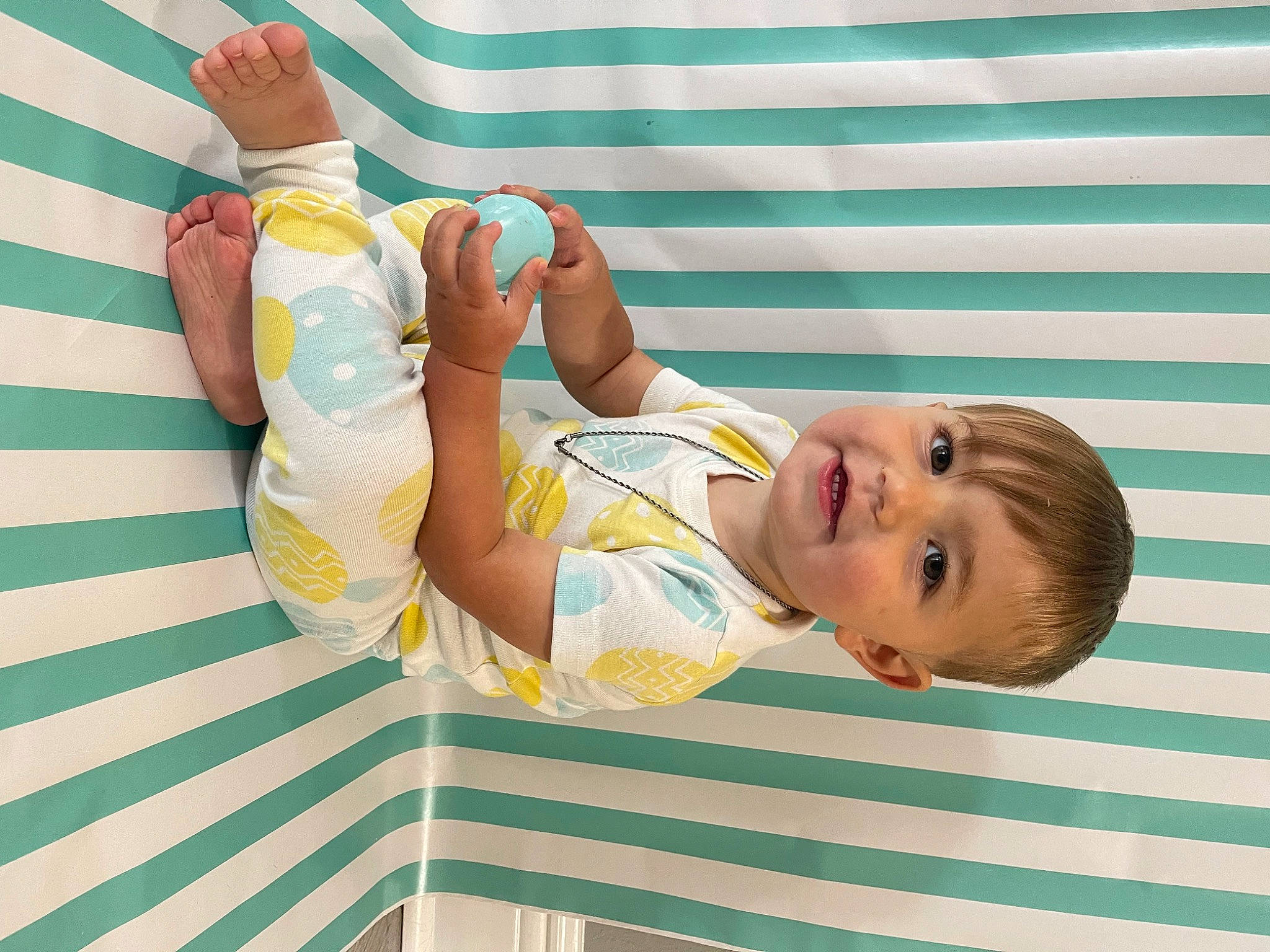 Joshua Jr. is registered to the contest to win money with this photo: arm, baby, baby_products, baby_toddler_clothing, child, elbow, fun, happy, hat, human_leg, joy, leisure, organ, pattern, person, room, smile, thigh, toddler, vacation