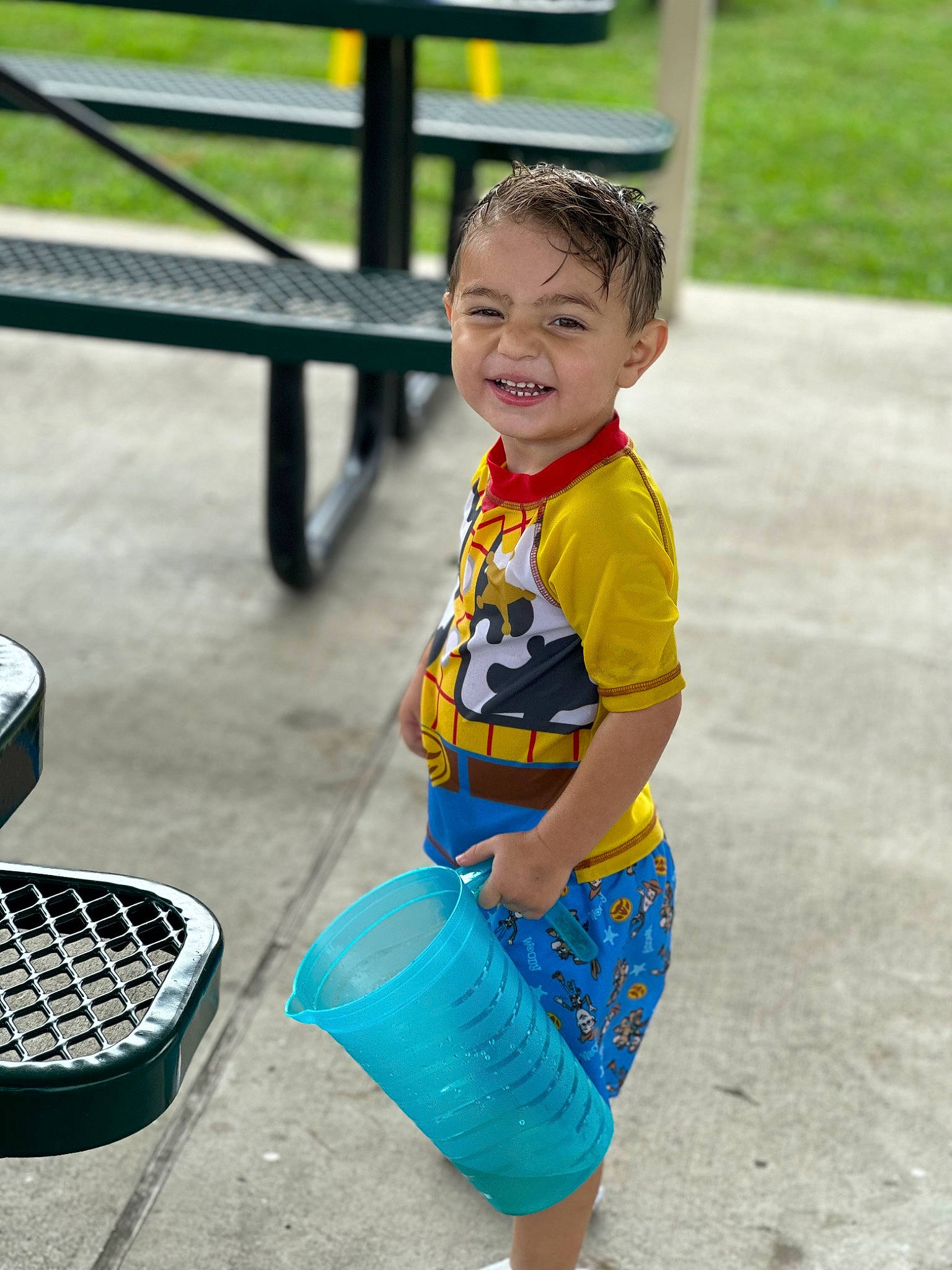 Joshua Jr. is registered to the contest to win money with this photo: asphalt, child, city, denim, electric_blue, fun, grass, happy, human_leg, leisure, pattern, person, play, recreation, shorts, sitting, sleeve, smile, t_shirt, toddler