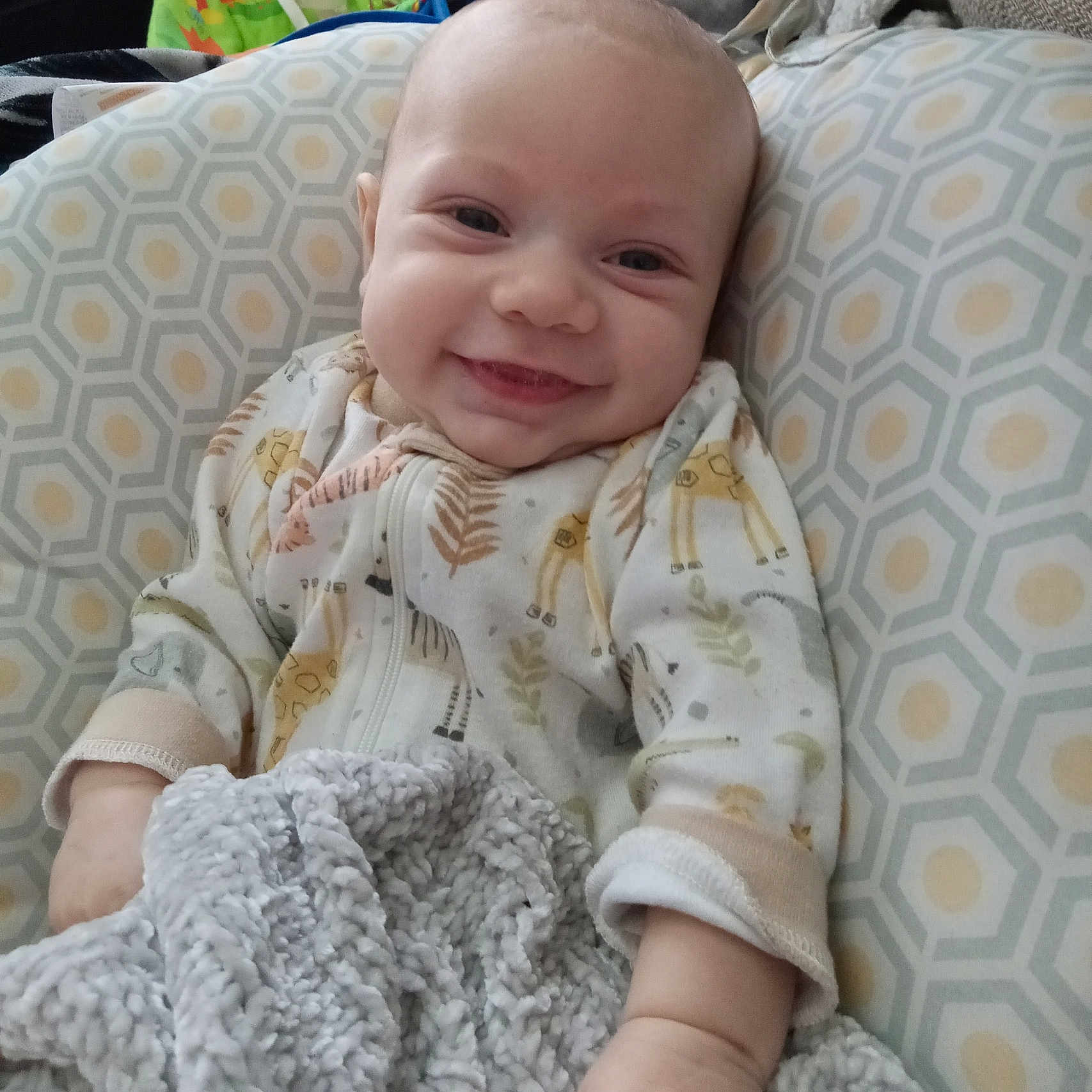 Rylan joined the competition — help win amazing prizes! baby, blanket, car, car_interior, carseat, couch, crib, cushion, face, furniture, head, homedecor, infantbed, linen, newborn, person, photography, portrait, quilt, transportation