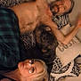bed, bedding, blonde, casual, cat, cozy, filter, hearts, indoor, lying_down, man, pet, pillow, plaid_pants, relaxed, selfie, shirtless, tabby_cat, woman, zebra_pattern