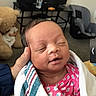 baby, blanket, car_seat, child, cozy, cute, hand, home, indoor, infant, newborn, patterned_clothing, peaceful, person, pink_clothing, portrait, resting, sleeping, teddy_bear, towel