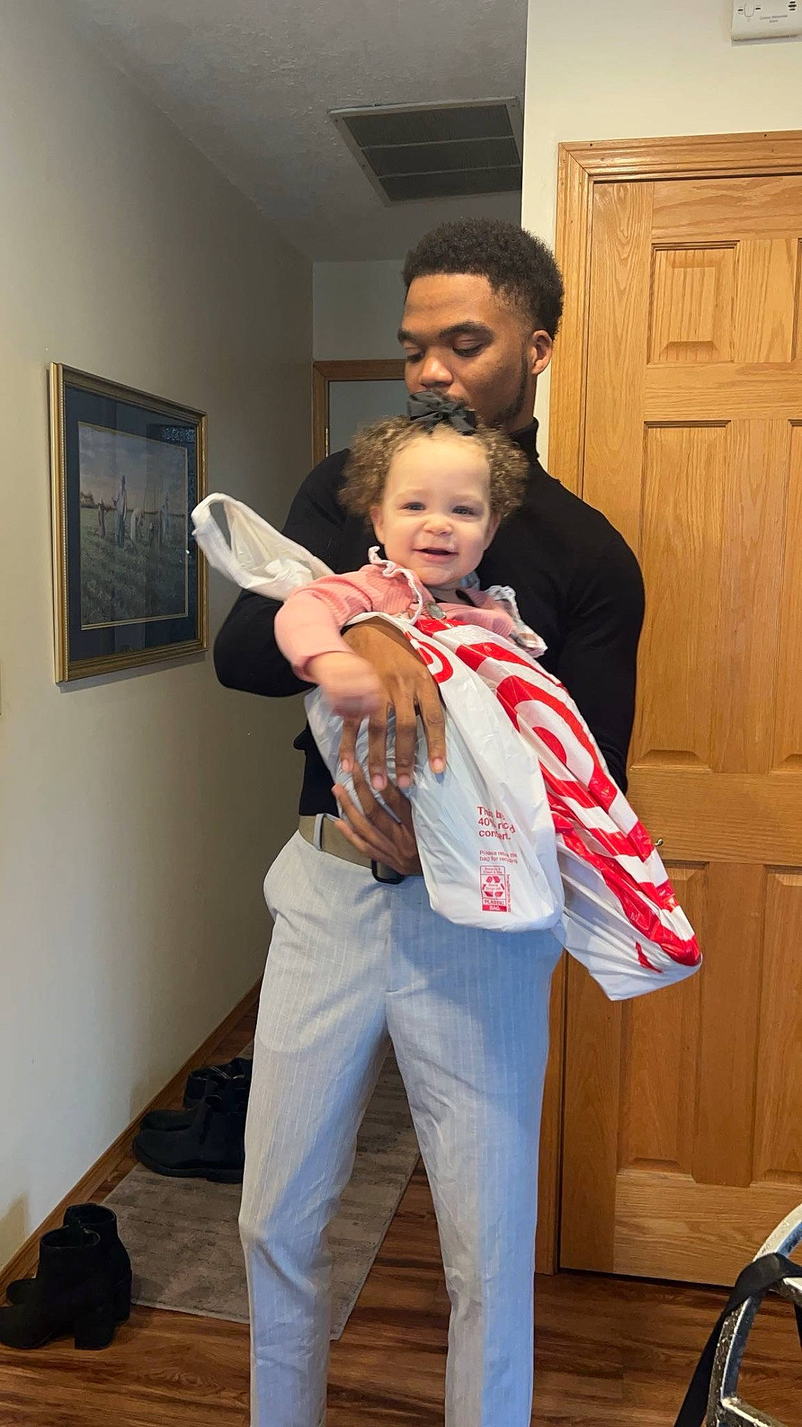 Aylynn is registered to the contest to win money with this photo: bag, belt, child, costume, door, event, fashion_design, flooring, formal_wear, fun, fur, gesture, happy, joy, luggage_and_bags, person, picture_frame, room, shoulder, smile