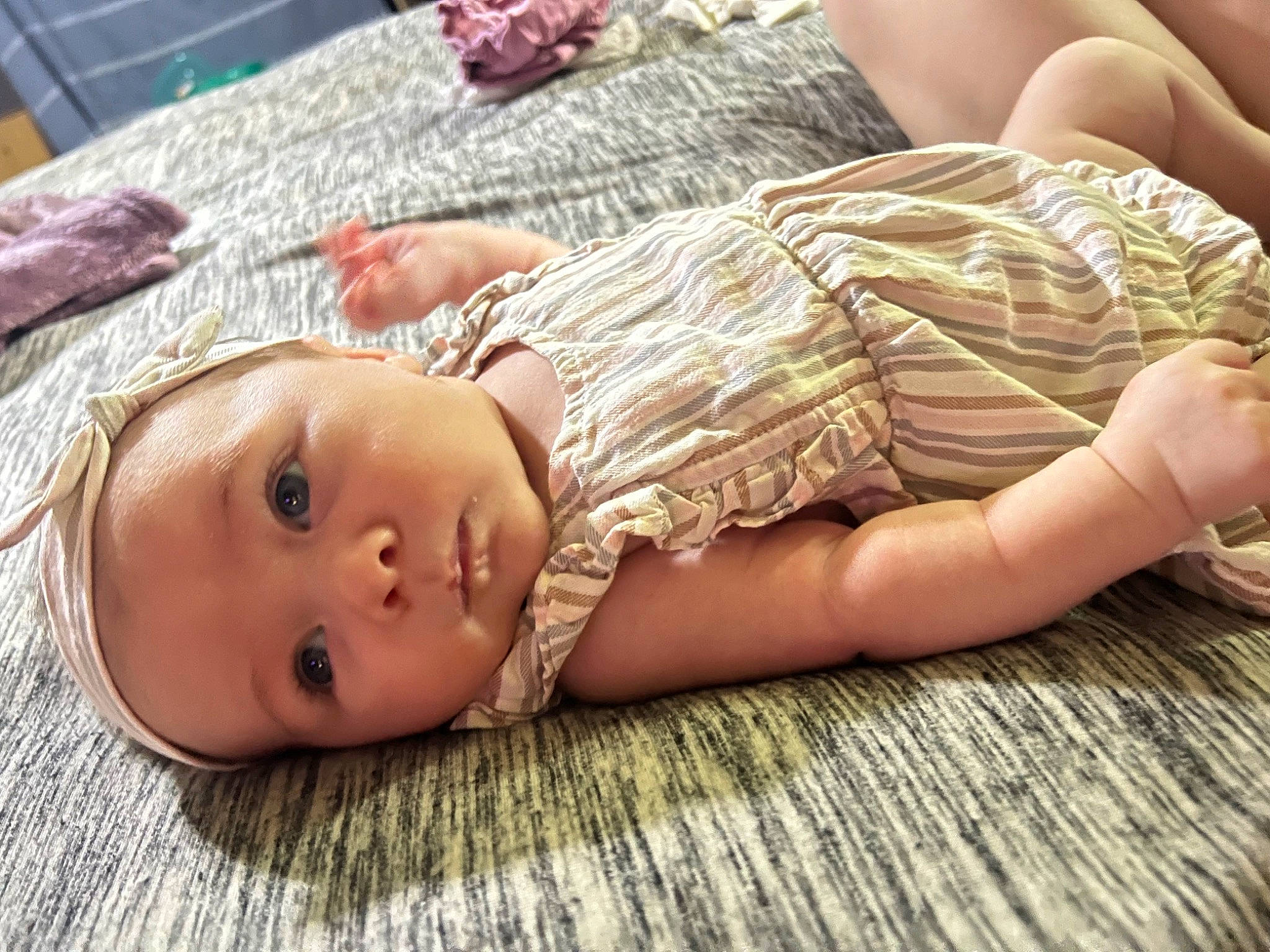 Maizey joined the competition — help win amazing prizes! abdomen, baby, baby_toddler_clothing, barefoot, cheek, child, comfort, flooring, grass, happy, human_body, human_leg, linens, pattern, person, pink, sitting, skin, thigh, toddler