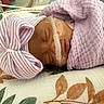 Ainhoa joined the competition — help win amazing prizes! baby, bed, blanket, breathing_tube, closed_eyes, face, floral_pattern, hat, hospital, indoors, infant, medical_equipment, medical_tape, mittens, newborn, peaceful, portrait, sleeping, swaddled, vulnerable