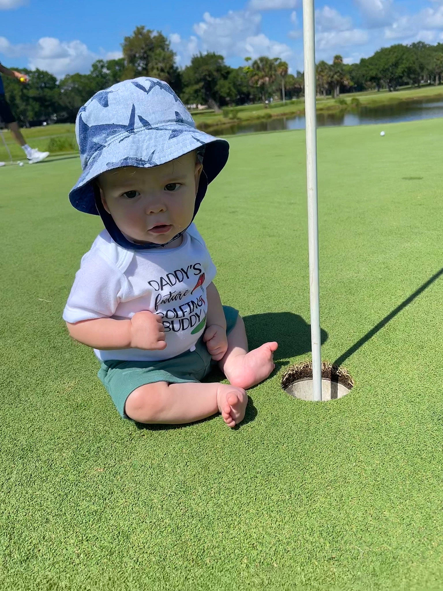 Tristin joined the competition — help win amazing prizes! cap, cloud, golf_equipment, grass, grass_family, grassland, hat, headwear, landscape, lawn, leisure, meadow, natural_environment, nature, people_in_nature, person, plant, recreation, sky, sun_hat