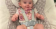 Azeleigh joined the competition — help win amazing prizes! baby, baby_seat, barefoot, child, comfort, cute, face, floral_bib, furniture, happy, head, indoors, infant, onesie, patterned_fabric, person, seat, skin, smile, straps