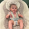 baby, baby_seat, barefoot, child, comfort, cute, face, floral_bib, furniture, happy, head, indoors, infant, onesie, patterned_fabric, person, seat, skin, smile, straps