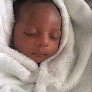 Elias is registered to the contest to win money with this photo: adorable, baby, blanket, child, closeup, comfort, cozy, cute, face, fur, head, infant, newborn, peaceful, portrait, rest, sleeping, soft, warm, wrapped