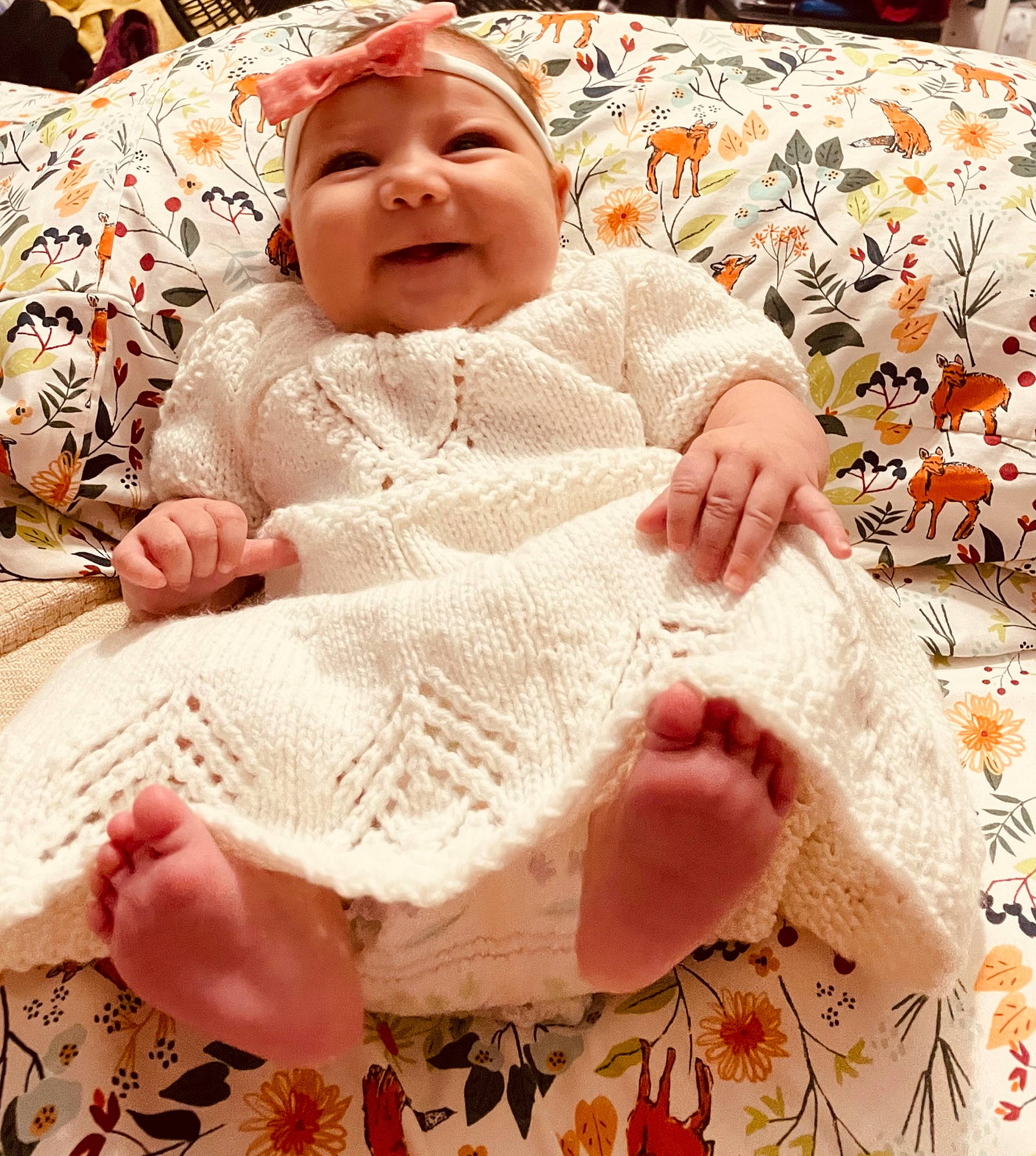 Luxa is registered to the contest to win money with this photo: baby, baby_toddler_clothing, cheek, child, comfort, craft, creative_arts, embellishment, happy, head, headwear, linens, pattern, person, pink, sitting, skin, sleeve, smile, toddler