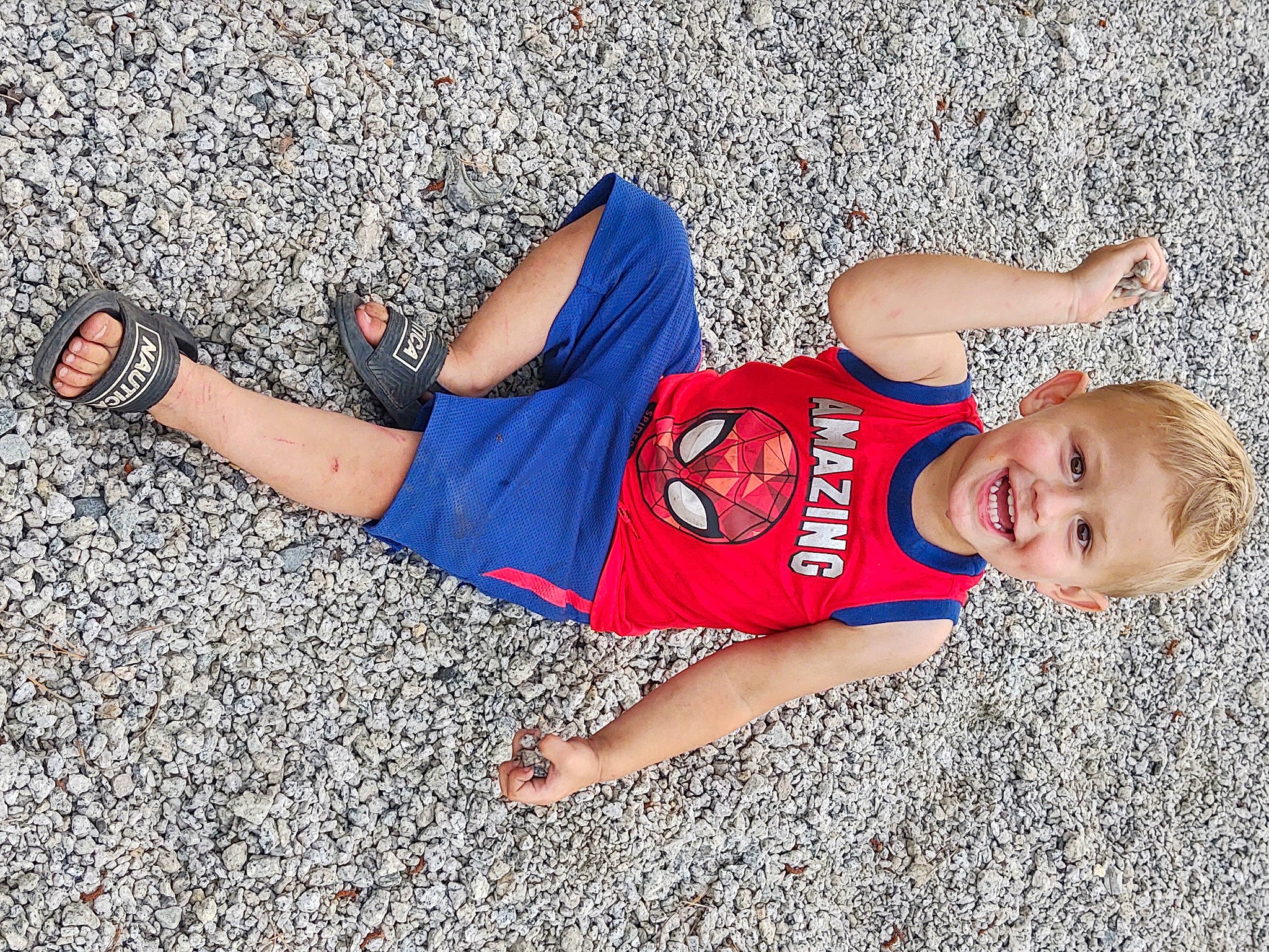 Miles is registered to the contest to win money with this photo: arm, asphalt, denim, electric_blue, foot, fun, happy, hat, human_leg, joint, joy, knee, leisure, person, sportswear, street_fashion, sunglasses, t_shirt, thigh, trunk