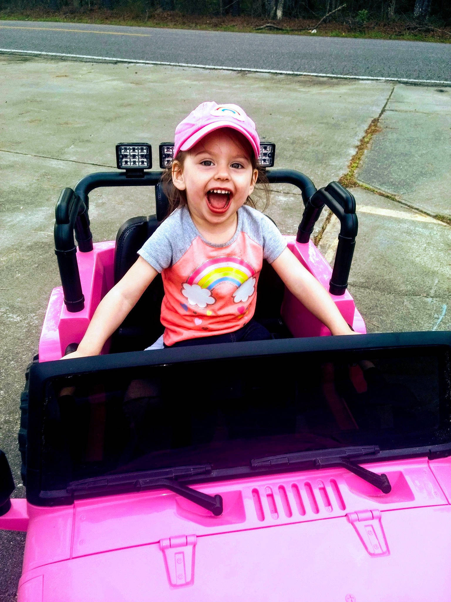 Annabella joined the competition — help win amazing prizes! automotive_design, automotive_exterior, automotive_lighting, automotive_tire, automotive_wheel_system, baby_toddler_clothing, bumper, fun, happy, headwear, hood, leisure, magenta, motor_vehicle, person, pink, smile, t_shirt, toddler, vehicle