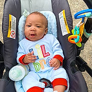 Israel joined the competition — help win amazing prizes! baby, infant, car_seat, bottle, toy, onesie, outdoor, child, cute, smiling, seat_belt, playful, colorful_clothing, footwear, baby_shoes, pacifier_clip, fabric, comfort, safety, young_child