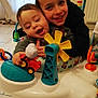 Aïssa participe au concours pour gagner de l'argent avec cette photo : baby, baby_activity_center, brother, child, clothing, colorful, curtain, floor, furniture, happy, hug, indoor, person, plastic, play, radiator, sibling, smile, toddler, toy
