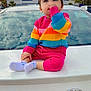 Tripat joined the competition — help win amazing prizes! toddler, child, rainbow_sweater, pink_pants, white_car, toyota, license_plate, outdoor, sky, clouds, building, golden_domes, sitting, thumb_sucking, cute, colorful_clothing, portrait, daytime, vehicle, young_child