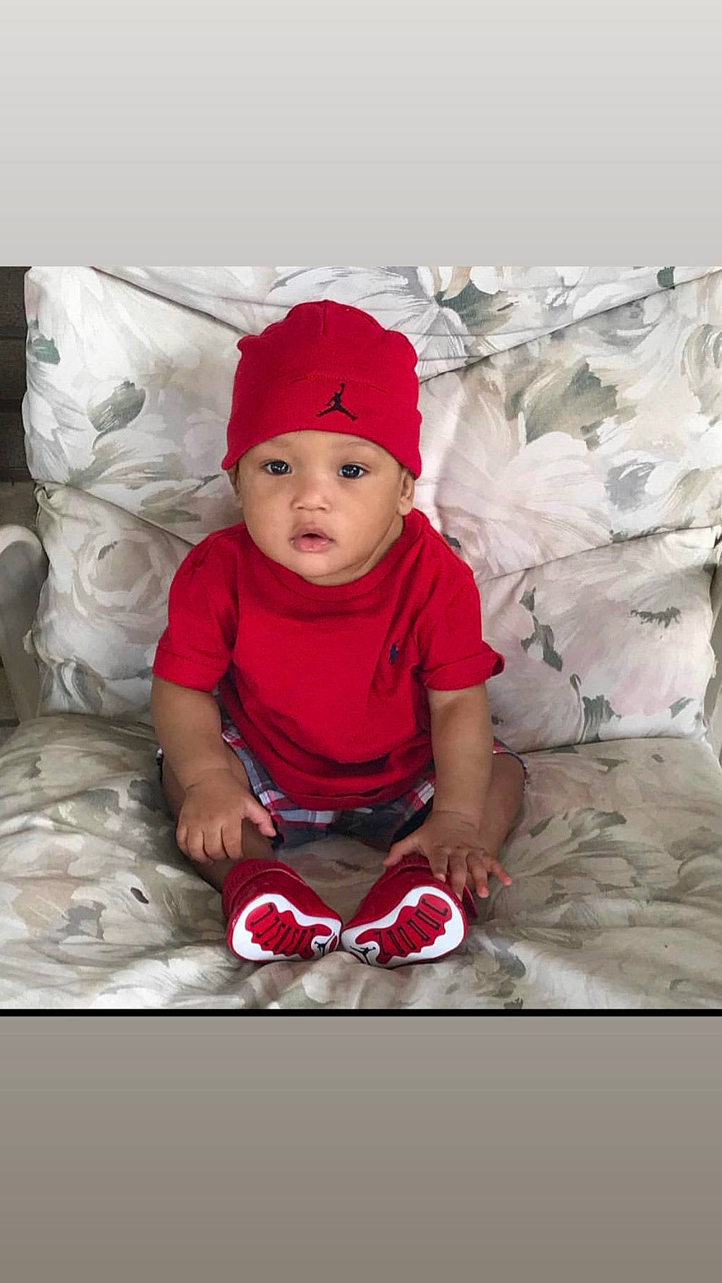 Deshawn is registered to the contest to win money with this photo: baby, beanie, bonnet, cap, child, headgear, headwear, person, red, smile, toddler