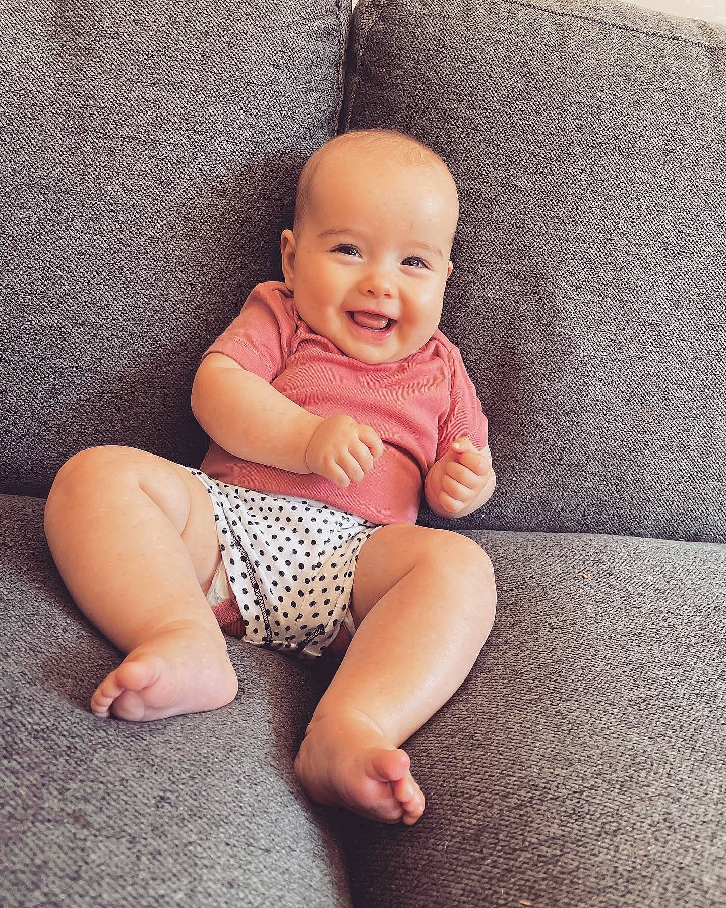 Billie is registered to the contest to win money with this photo: baby, baby_toddler_clothing, barefoot, comfort, finger, flash_photography, floor, flooring, foot, happy, joint, joy, knee, leg, person, pink, skin, sleeve, smile, textile