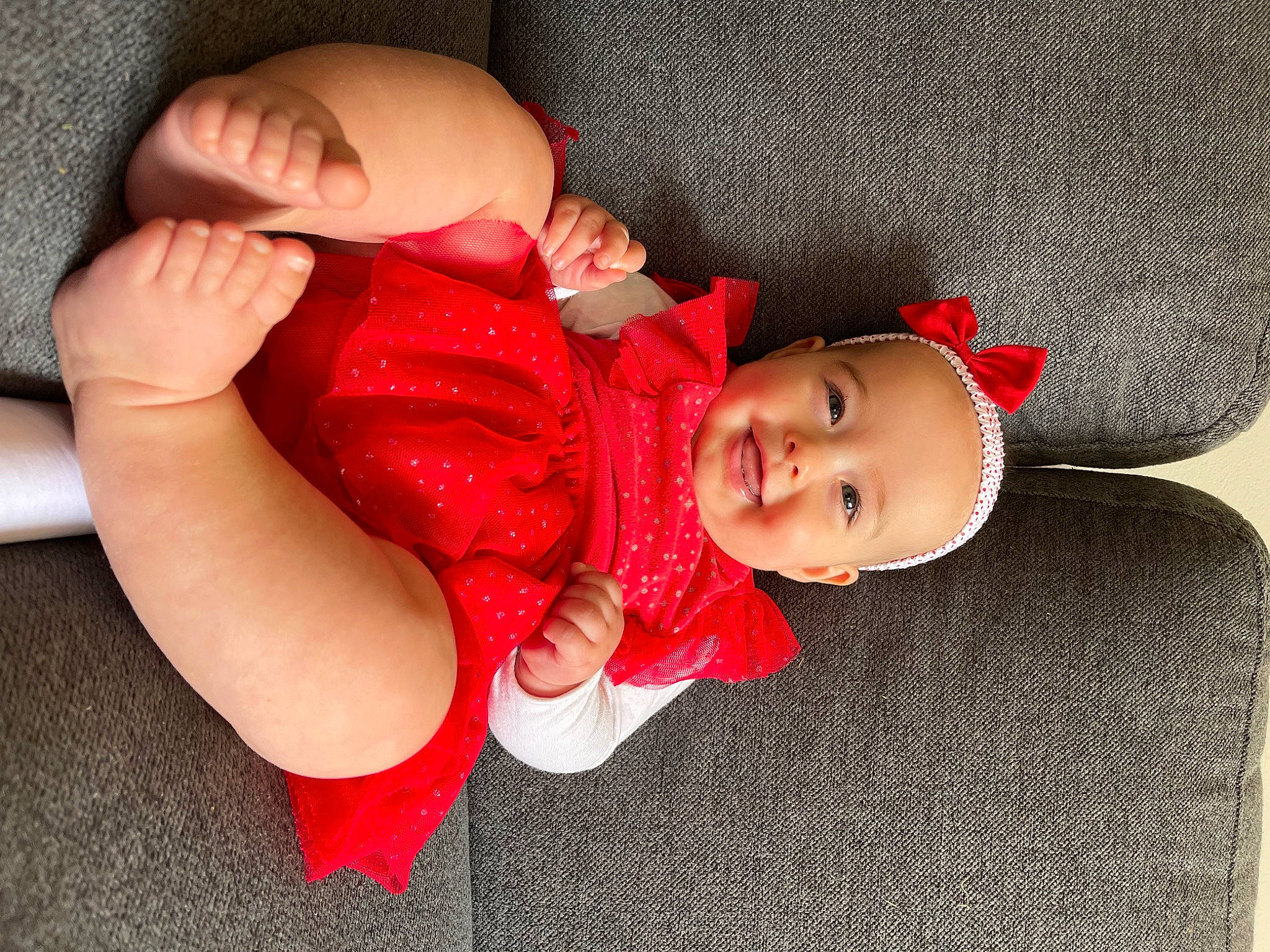 Billie is registered to the contest to win money with this photo: arm, baby, baby_sleeping, baby_toddler_clothing, comfort, eye, face, facial_expression, finger, gesture, hand, headgear, human_body, joy, leg, lip, mouth, nail, person, skin