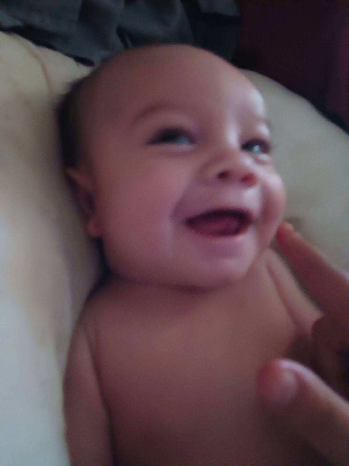 Michael is registered to the contest to win money with this photo: baby, cheek, ear, eye, eyebrow, eyelash, finger, forehead, gesture, happy, iris, jaw, lip, mouth, neck, nose, person, skin, smile, toddler