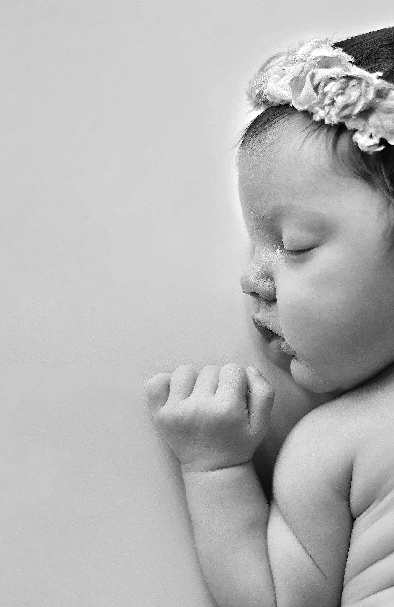 Kaelani is registered to the contest to win money with this photo: arm, baby, beauty, black_and_white, cheek, child, eye, face, finger, hair_accessory, hand, head, lip, monochrome_photography, nose, person, photograph, photography, skin, toddler