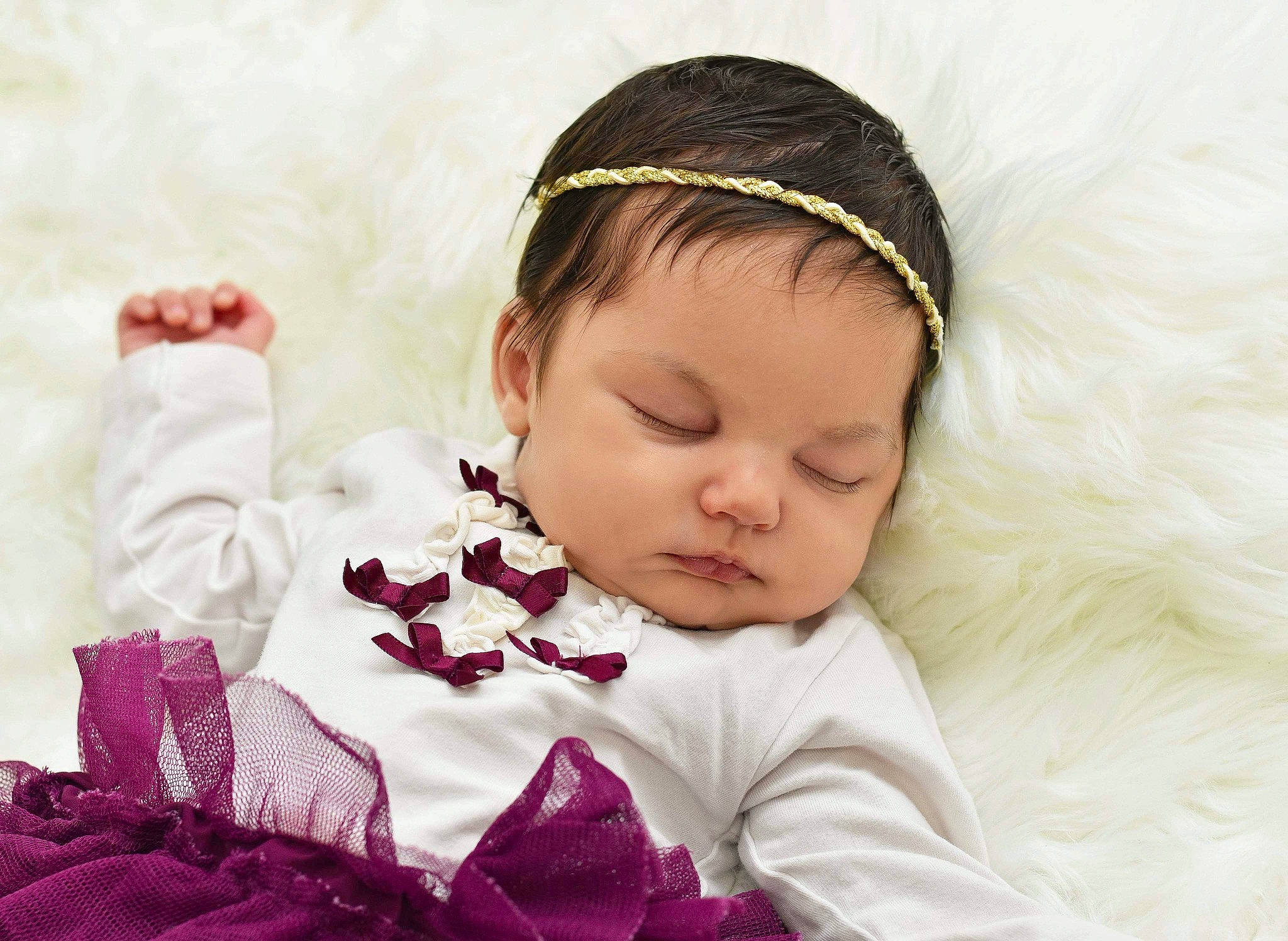 Kaelani is registered to the contest to win money with this photo: baby, baby_sleeping, brown_hair, cheek, child, crown, ear, fashion_accessory, forehead, hair_accessory, hand, head, headband, headgear, headpiece, person, photography, pink, purple, textile