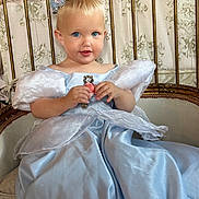 Viviana joined the competition — help win amazing prizes! toddler, child, princess, dress, blue_dress, tiara, crown, flower, smile, face, blue_eyes, sitting, chair, vintage, furniture, indoor, portrait, cute, baby, costume