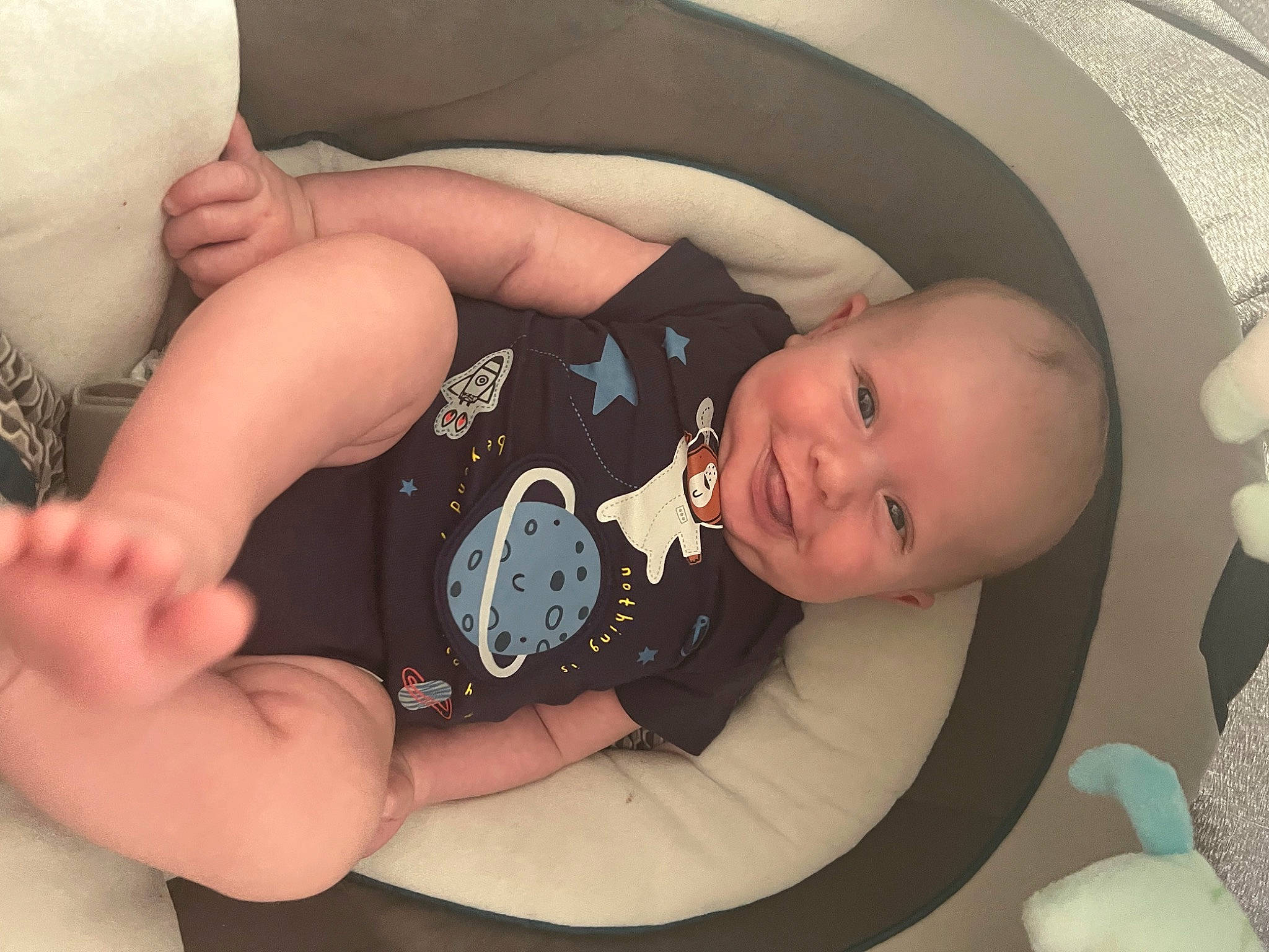 Azaiah is registered to the contest to win money with this photo: arm, baby, baby_products, baby_toddler_clothing, child, comfort, elbow, eye, finger, hand, head, human_body, joy, knee, leg, mouth, person, product, skin, thigh