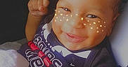 Braylin is registered to the contest to win money with this photo: baby, smiling, child, face, car_seat, blanket, clothing, infant, happy, portrait, seatbelt, filter, stars, moon, hand, indoors, cute, young_child, person, photography