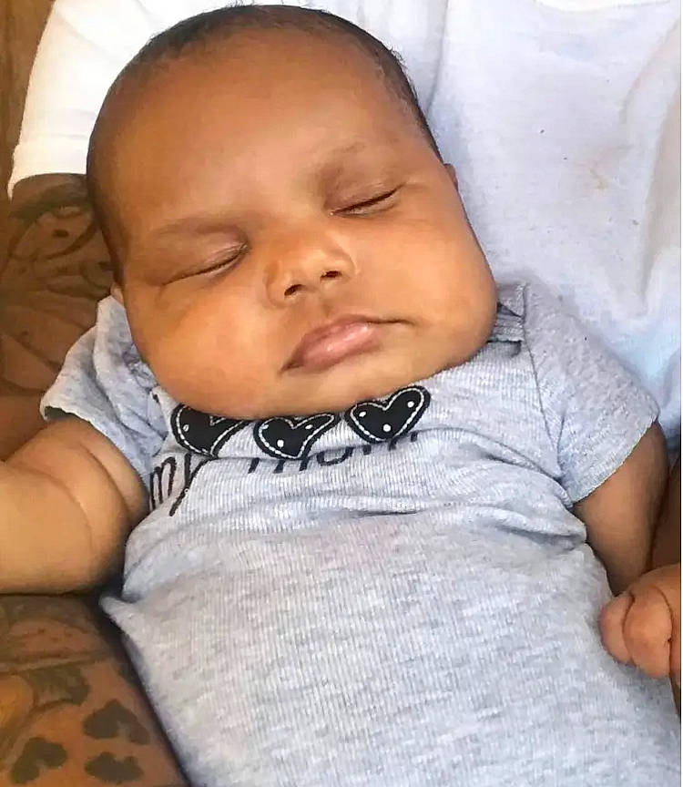 Brooklyn is registered to the contest to win money with this photo: baby, baby_toddler_clothing, cheek, child, chin, comfort, eyelash, forehead, happy, iris, linens, lip, mouth, neck, nose, person, skin, sleeve, smile, textile