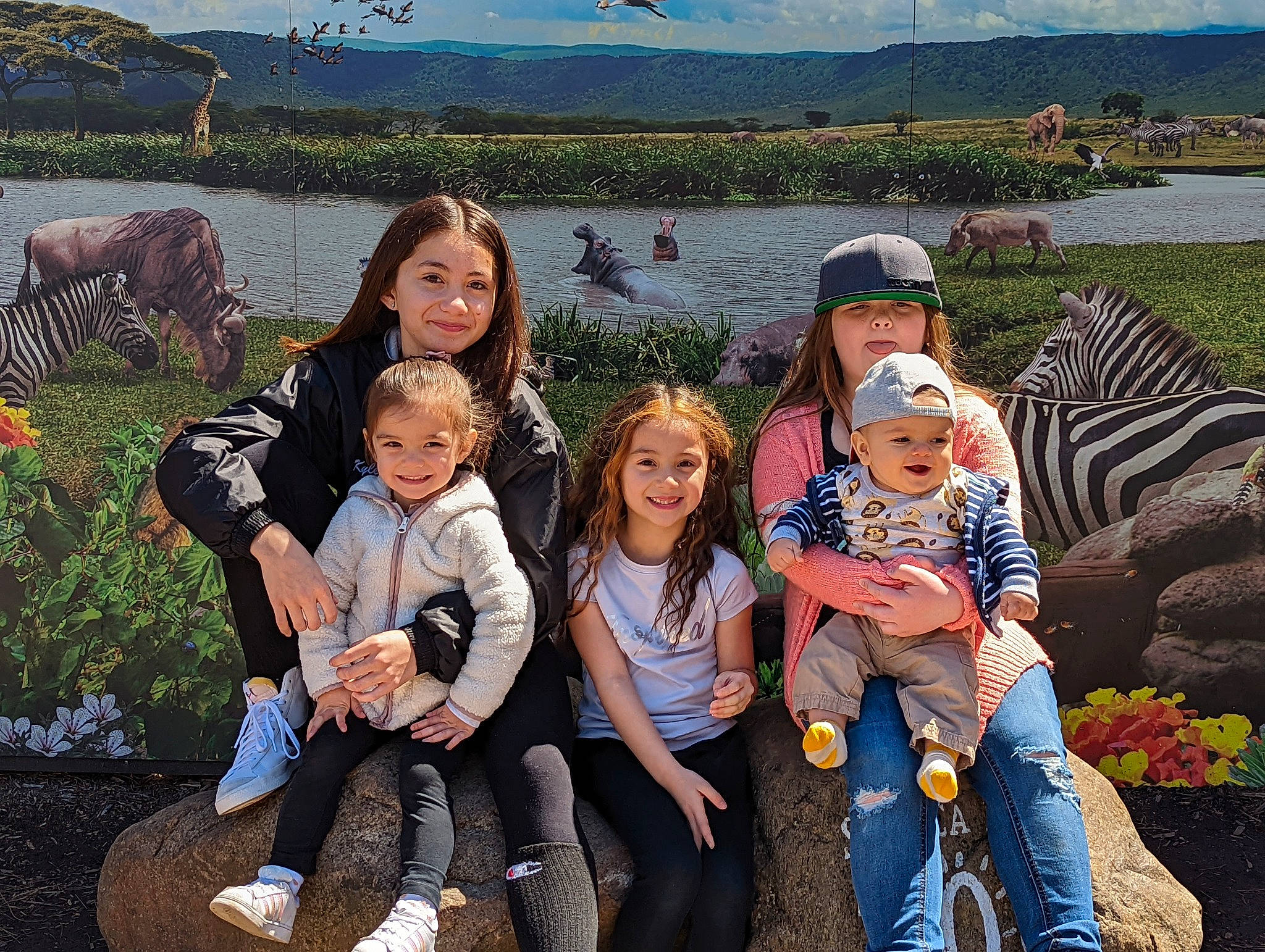 Rowan joined the competition — help win amazing prizes! community, friendship, fun, grass, green, happy, headwear, jeans, joy, lake, landscape, leisure, people_in_nature, person, plant, recreation, shoe, sky, smile, toddler