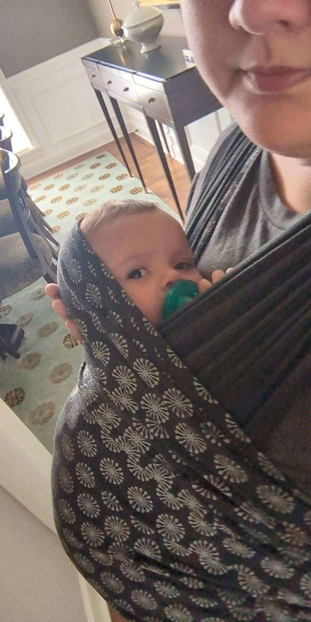 Rowan is registered to the contest to win money with this photo: baby, baby_products, chair, child, comfort, cool, finger, flooring, fun, hand, linens, mammal, pattern, person, room, shawl, sitting, t_shirt, toddler, wood