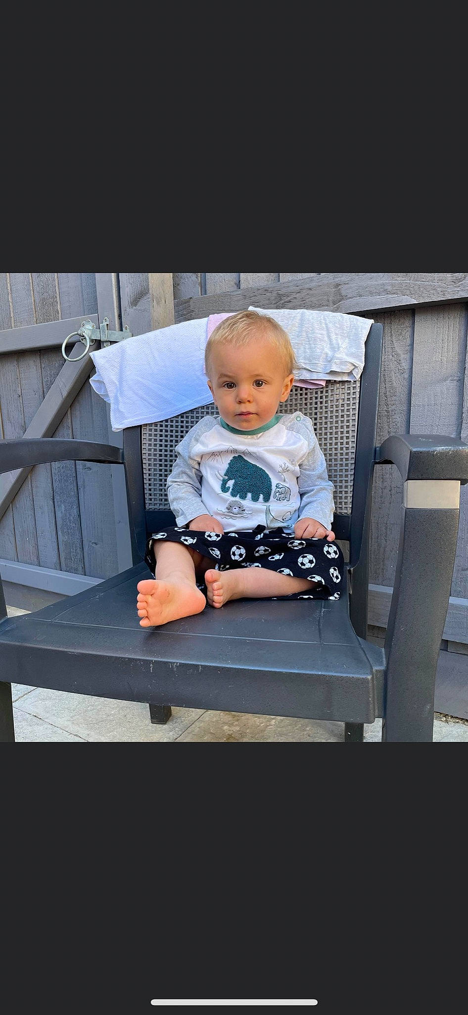 Kylo is registered to the contest to win money with this photo: baby, baby_carriage, baby_products, baby_toddler_clothing, chair, child, comfort, flash_photography, fun, leisure, outdoor_furniture, person, product, room, sitting, sleeve, sneakers, t_shirt, toddler, vacation