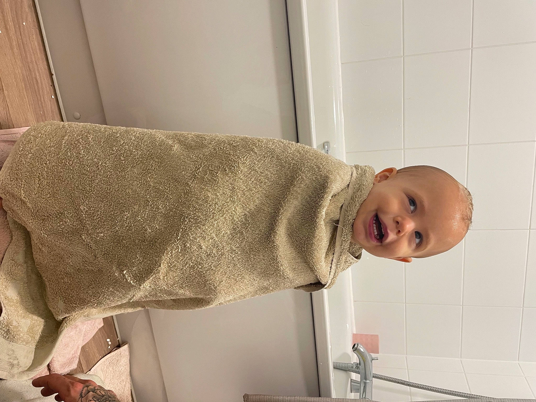 Kylo joined the competition — help win amazing prizes! baby, child, comfort, dress, elbow, flooring, fur, hat, human_body, human_leg, knee, linens, person, room, sleeve, smile, toddler, towel, wood, wool