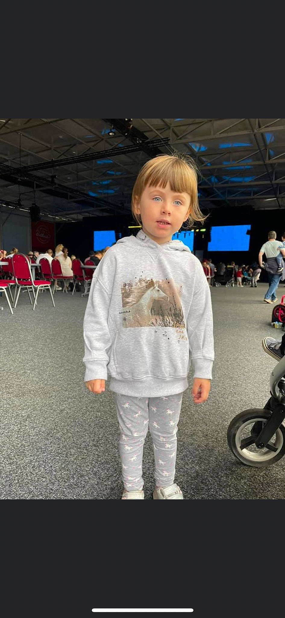 Elayah is registered to the contest to win money with this photo: asphalt, automotive_tire, chair, child, electric_blue, event, fashion, fun, human, person, product, recreation, rolling, sleeve, standing, street_fashion, t_shirt, tire, toddler, uniform