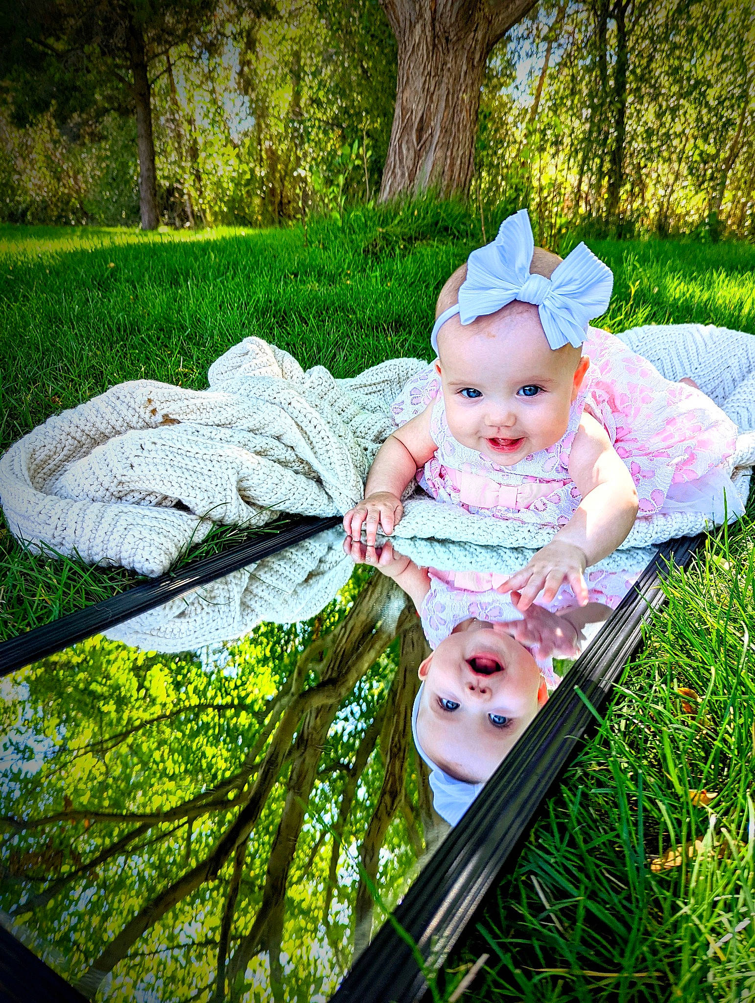 Evie is registered to the contest to win money with this photo: baby, baby_carriage, baby_products, baby_toddler_clothing, chair, child, fashion_accessory, grass, green, happy, hat, headwear, joy, leaf, leisure, people_in_nature, person, plant, recreation, sitting