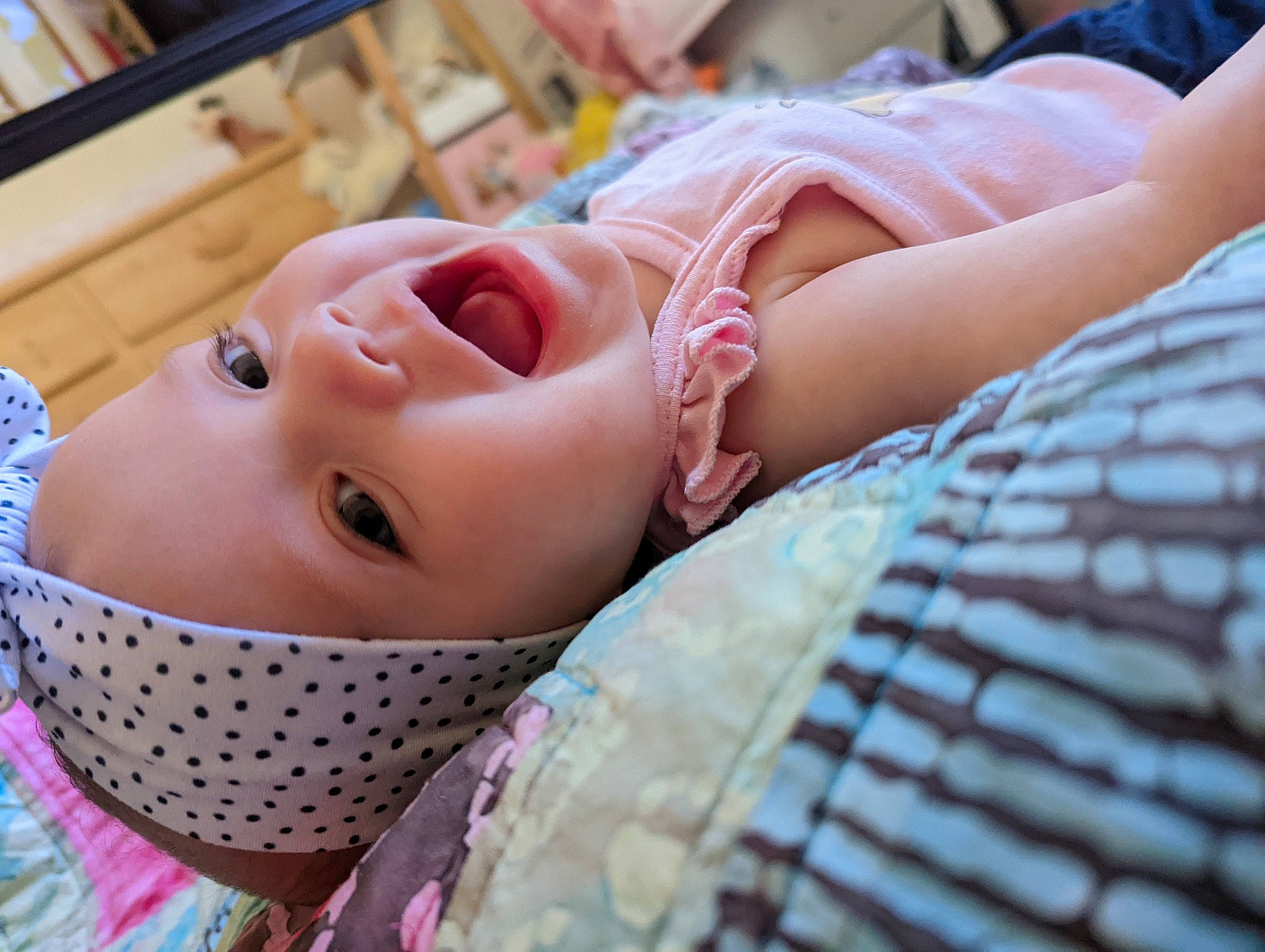 Evie is registered to the contest to win money with this photo: baby, baby_toddler_clothing, cheek, child, chin, close_up, comfort, eye, eyebrow, eyelash, facial_expression, happy, hat, headgear, headwear, iris, lip, mouth, nose, person