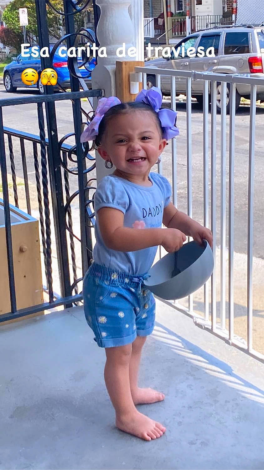 Lexis is registered to the contest to win money with this photo: baby_toddler_clothing, barefoot, blue, electric_blue, fence, fun, happy, hat, human_leg, joy, leg, leisure, person, recreation, sleeve, smile, summer, thigh, tire, toddler