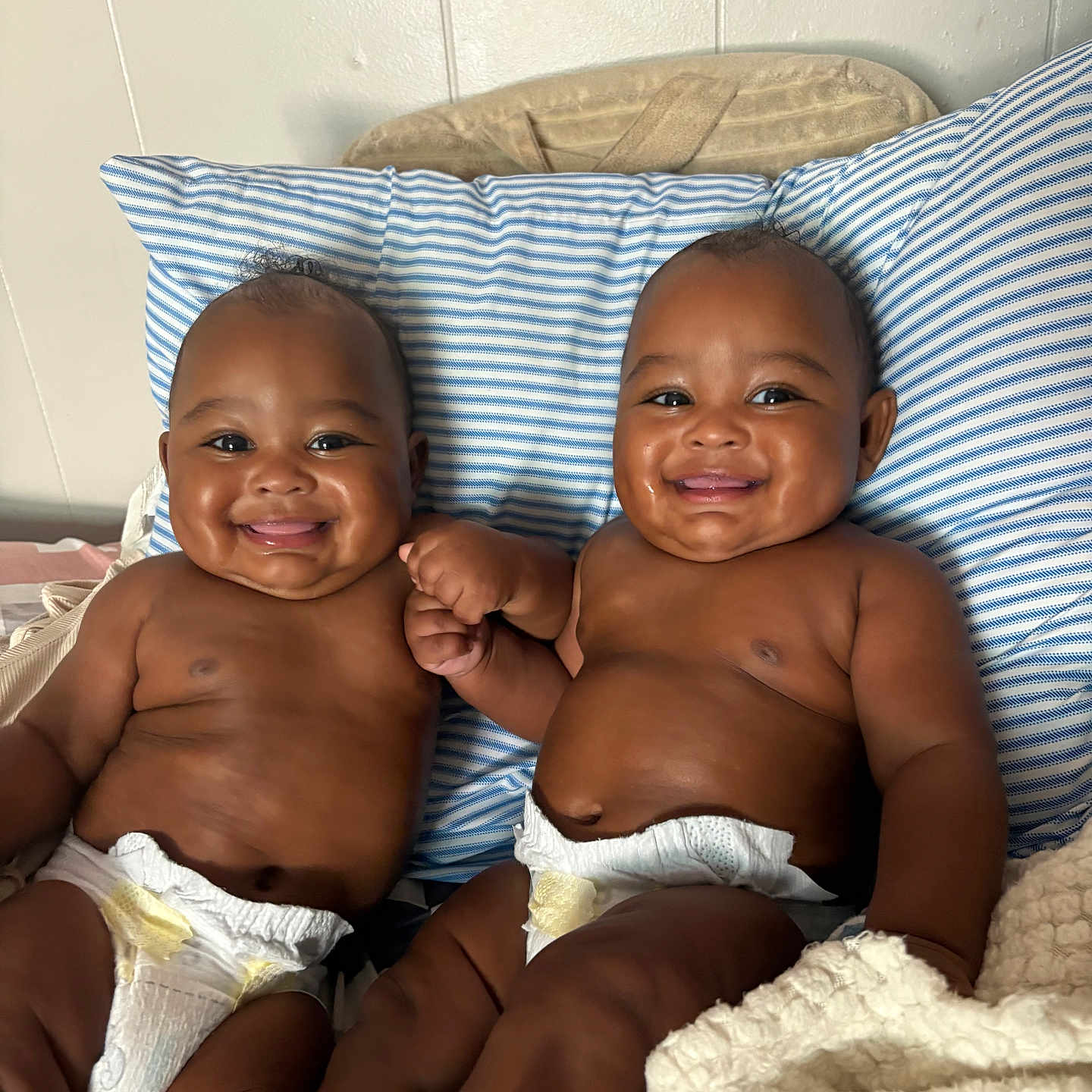 Lujuan Oshea joined the competition — help win amazing prizes! baby, bed, blanket, child, cute, diaper, face, friendship, happy, holding_hands, indoor, infant, joy, person, pillow, sitting, skin, smiling, twin, young