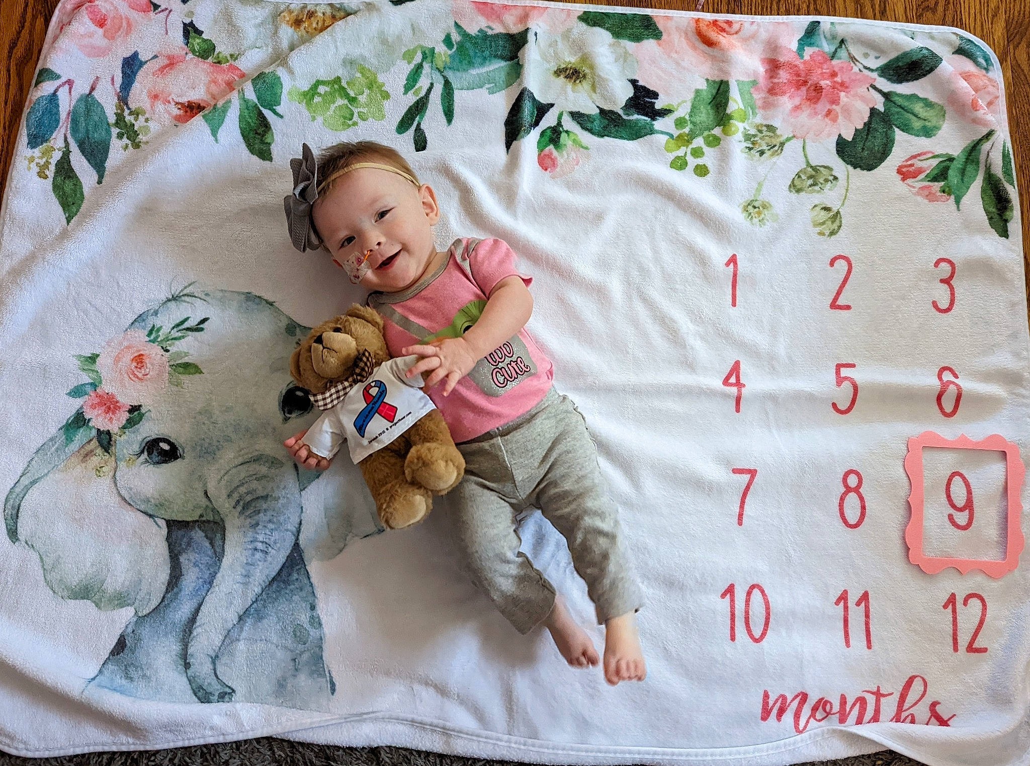 Fiona joined the competition — help win amazing prizes! baby, baby_sleeping, baby_toddler_clothing, bedding, child, comfort, hand, happy, linens, pattern, person, pink, product, room, sitting, skin, sleeve, smile, textile, throw_pillow