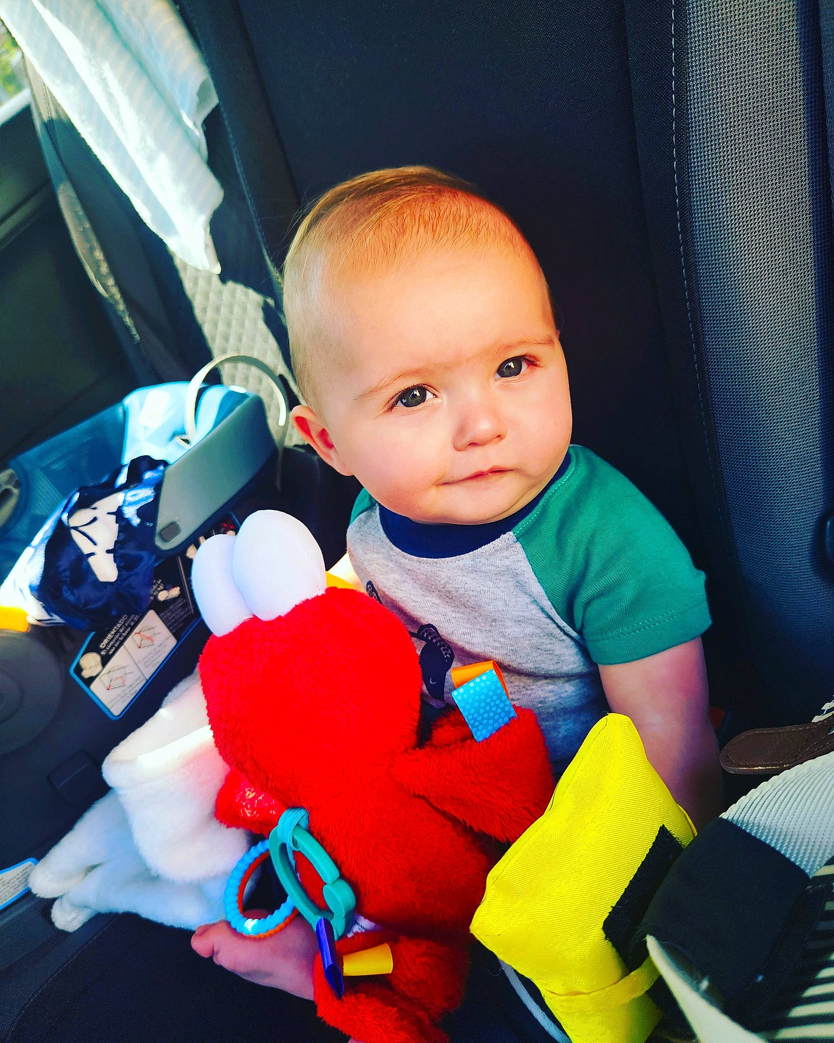 Micah is registered to the contest to win money with this photo: auto_part, baby, baby_carriage, baby_in_car_seat, baby_products, baby_safety, baby_toddler_clothing, car_seat, car_seat_cover, carmine, child, comfort, electric_blue, fun, head_restraint, person, product, seat_belt, steering_wheel, toddler