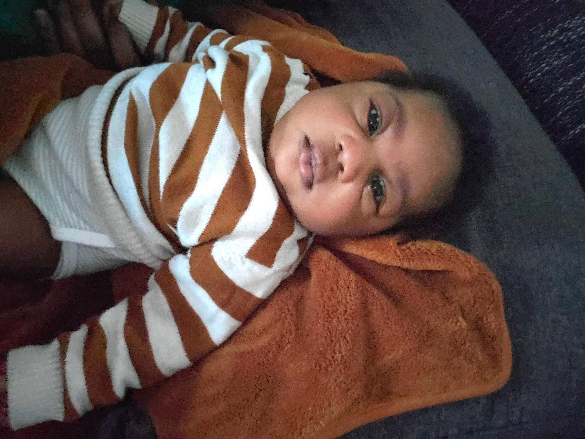 Noah participe au concours pour gagner de l'argent avec cette photo : baby, baby_toddler_clothing, cheek, child, chin, comfort, darkness, flash_photography, fun, fur, iris, linens, lip, nose, person, portrait_photography, room, skin, sleeve, toddler
