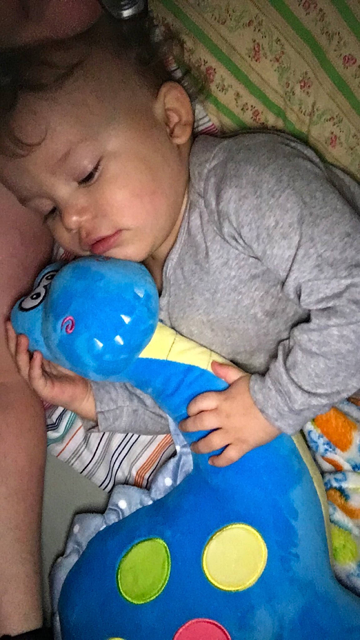Takoda is registered to the contest to win money with this photo: bedtime, blue, boy, cheek, child, eye, fun, head, infant, mouth, nap, nose, organ, person, play, product, skin, stuffed_toy, textile, toddler