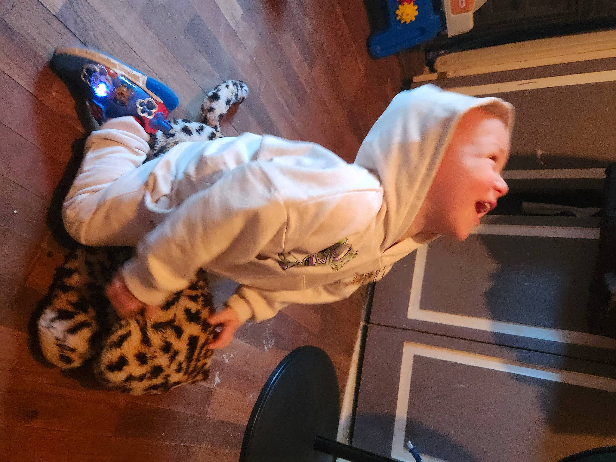 Issac is registered to the contest to win money with this photo: costume, elbow, entertainment, event, fun, hat, human_leg, knee, performance, performing_arts, person, personal_protective_equipment, room, sitting, thigh