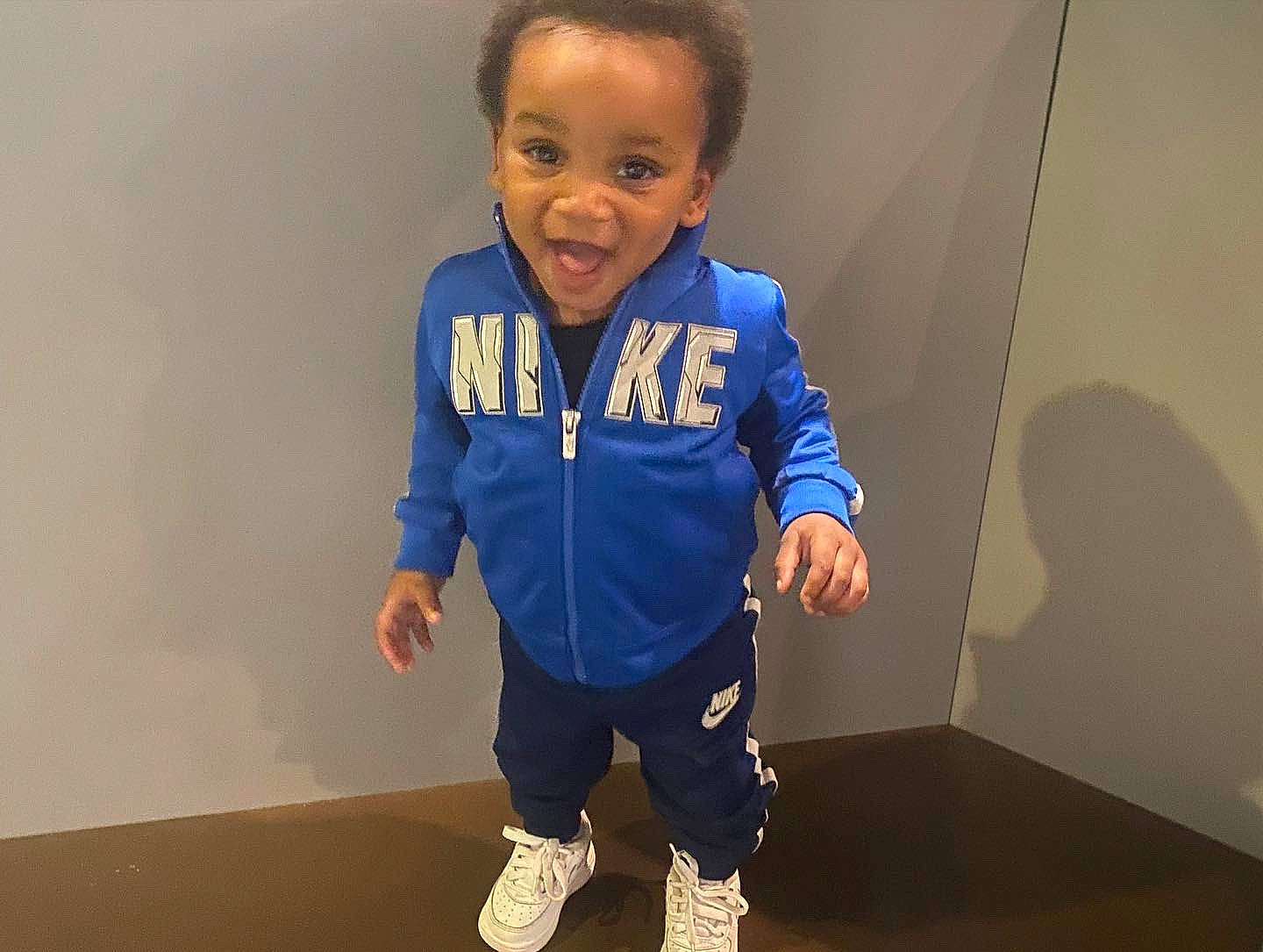 Davion joined the competition — help win amazing prizes! baby, baby_toddler_clothing, cheek, elbow, electric_blue, face, flooring, gesture, hair, happy, knee, neck, nose, person, shoulder, sleeve, smile, sportswear, t_shirt, thumb
